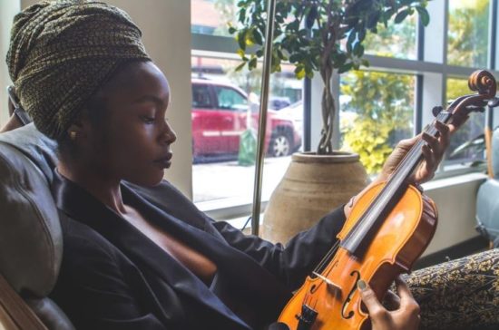 violin hold by a woman